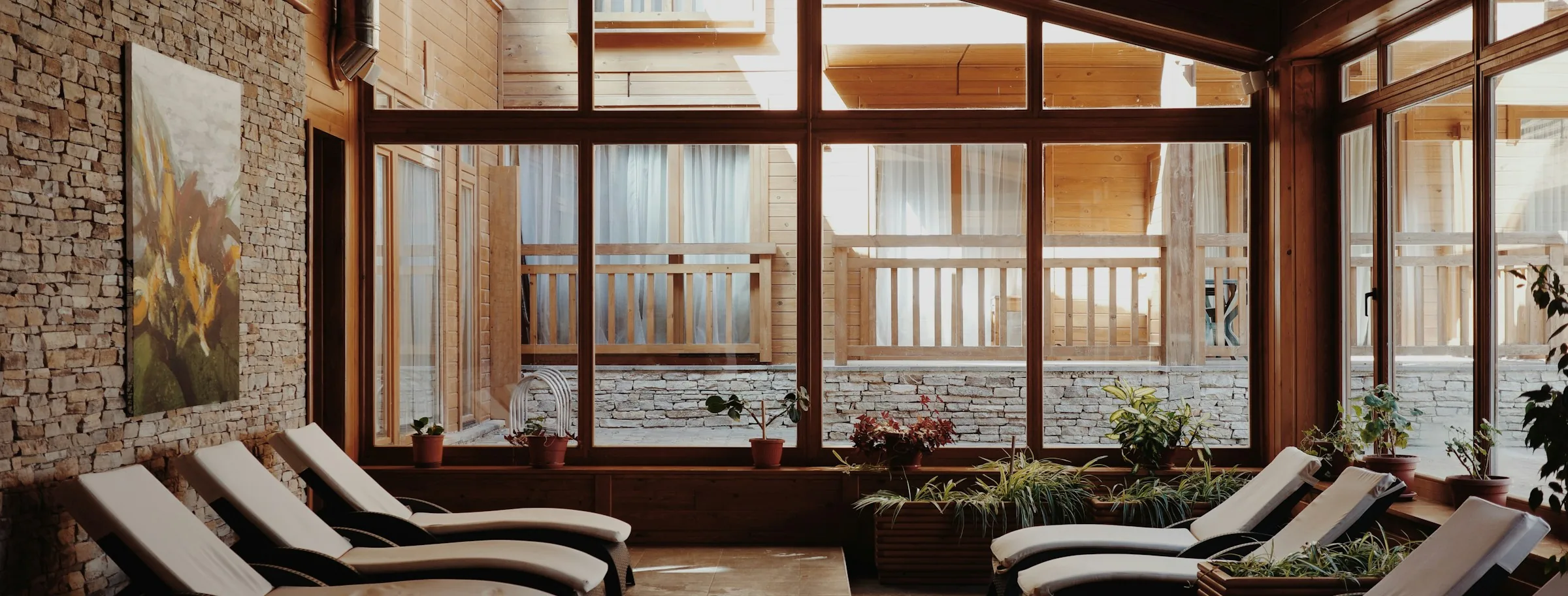 Sunlit spa relaxation room with lounge chairs